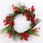 Frosted pine needle wreath with pine cone and red berries